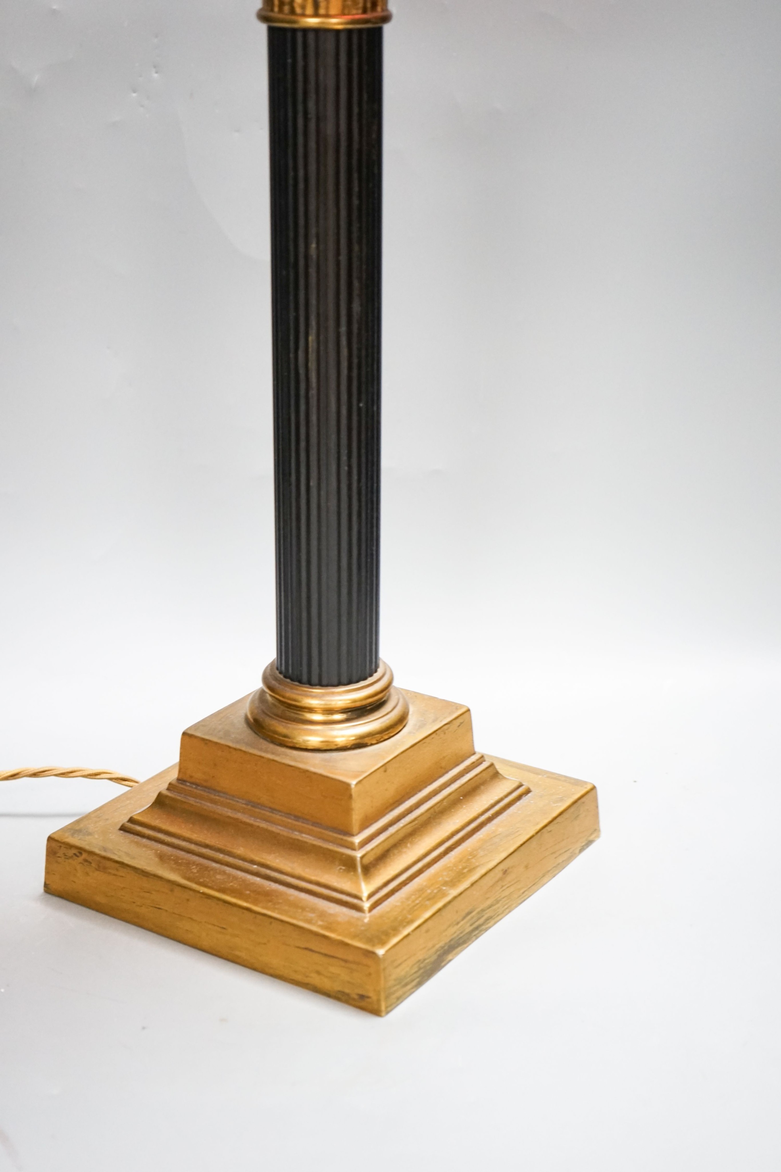 And early 20th century Corinthian column brass and cranberry glass oil lamp, converted for electricity, total height 70 cm